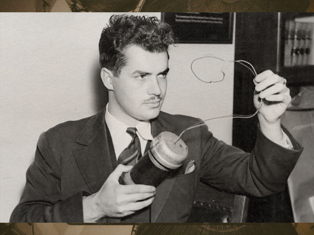 Parsons in 1938, holding the replica car bomb.