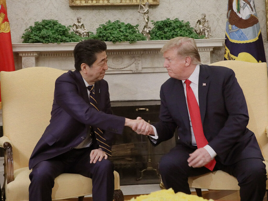 Former Japanese Prime Minister Shinzo Abe shaking Donald Trump's hand in 2019.