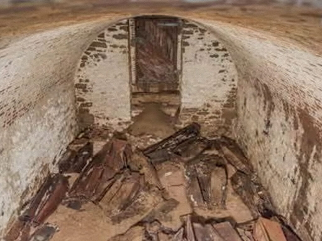 A previously unknown burial vault containing 20 wooden coffins underneath the park.
