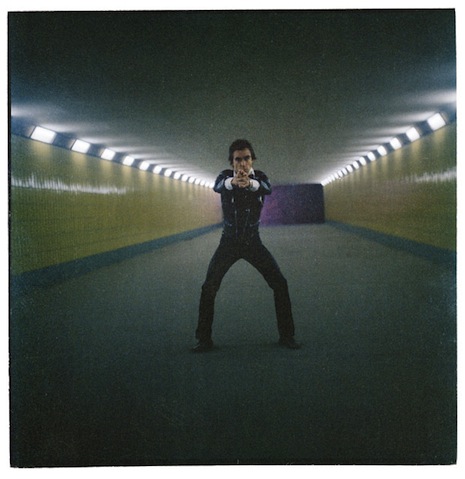 Striking a James Bond pose in a Berlin subway station, 1979. Taken with an old Rolleicord camera. 