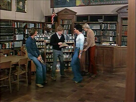 The bullies hassle the student librarian.